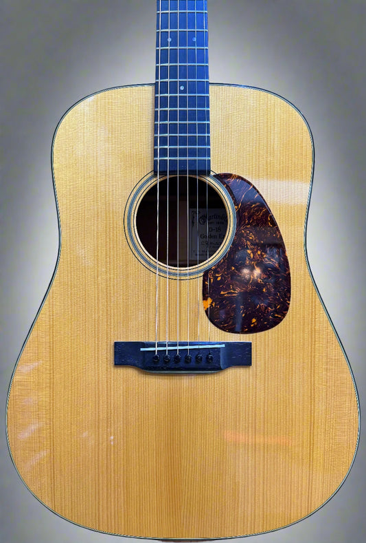 Acoustic guitar on a wooden surface