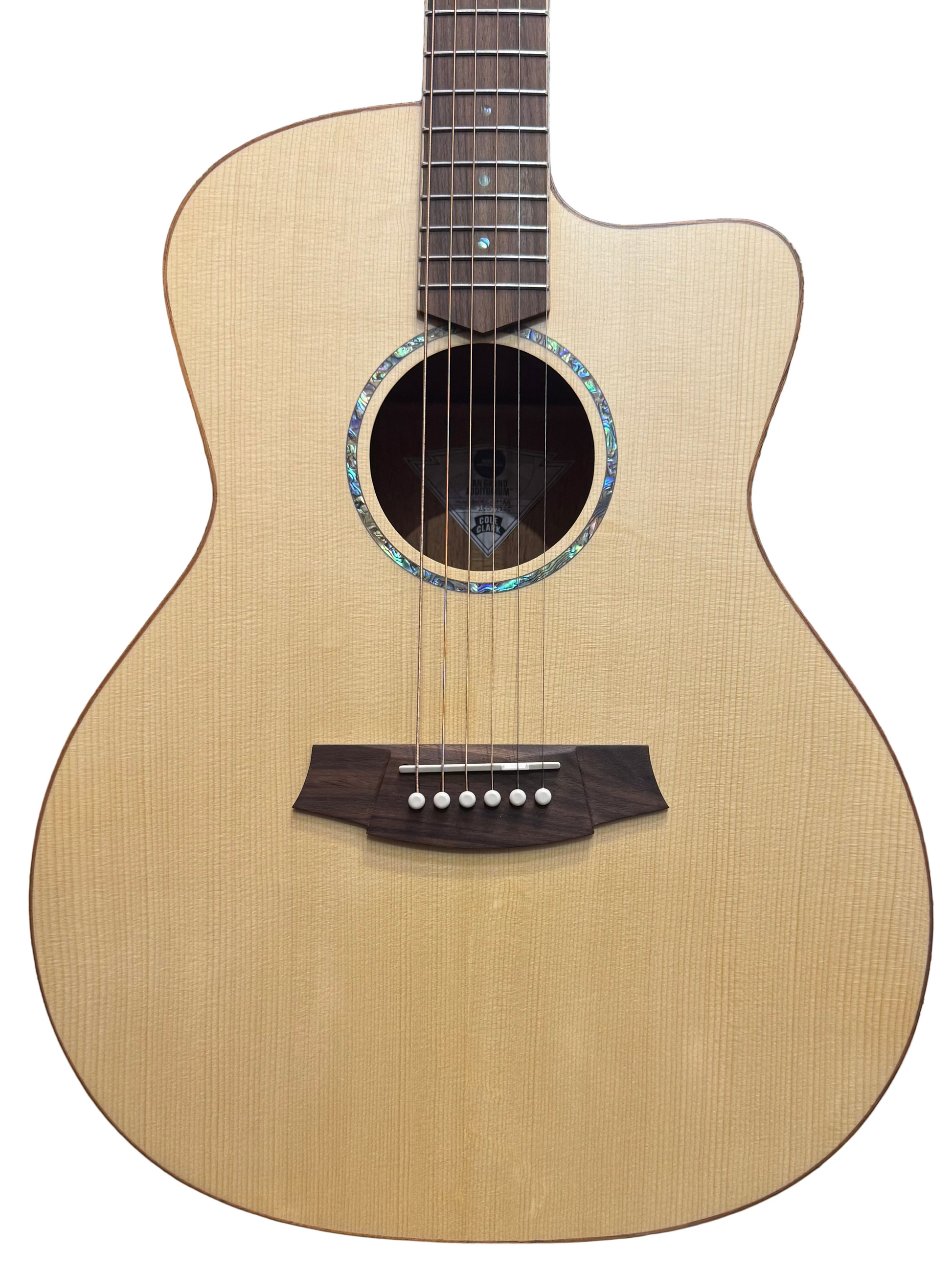 Acoustic guitar with a blurred background of other guitars
