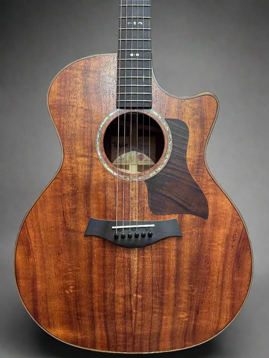 Acoustic guitar with a wooden finish in a store setting