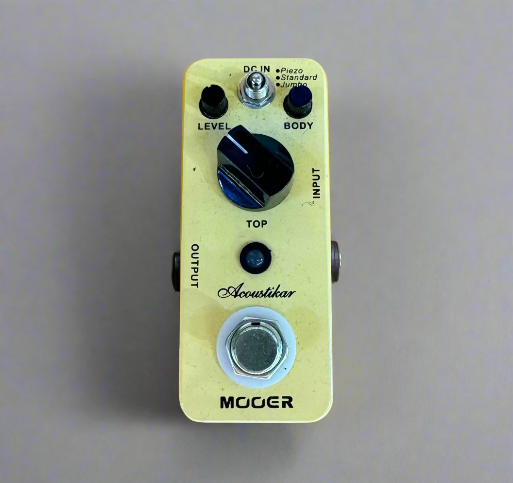 Guitar effects pedal on a wooden surface
