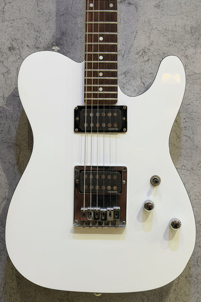 White electric guitar on a wooden background