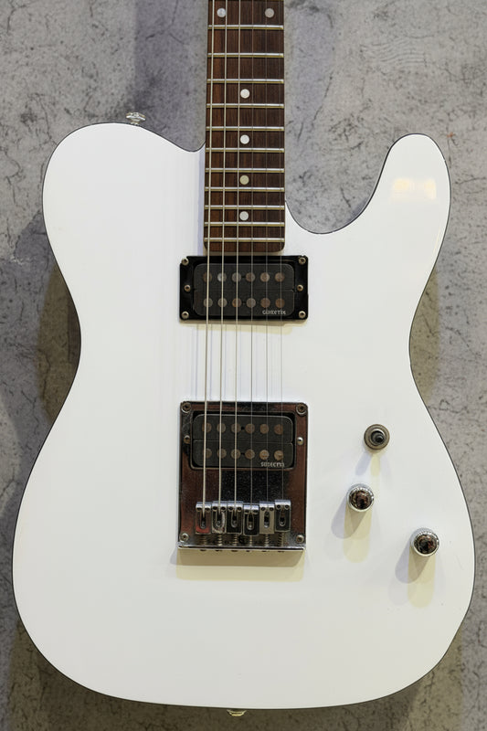 White electric guitar on a wooden background