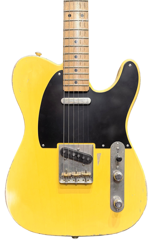 Yellow electric guitar with black pickguard against a background of other guitars