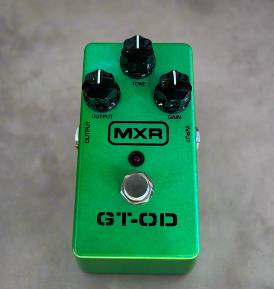 Green MXR GT-OD guitar effects pedal on a wooden surface