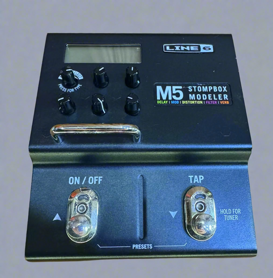 Line 6 M5 Stompbox Modeler guitar effects pedal on a wooden surface
