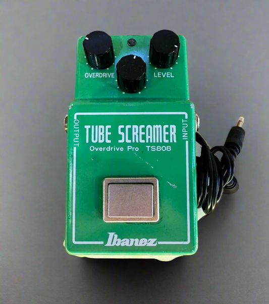 Ibanez Tube Screamer overdrive pedal on a wooden surface