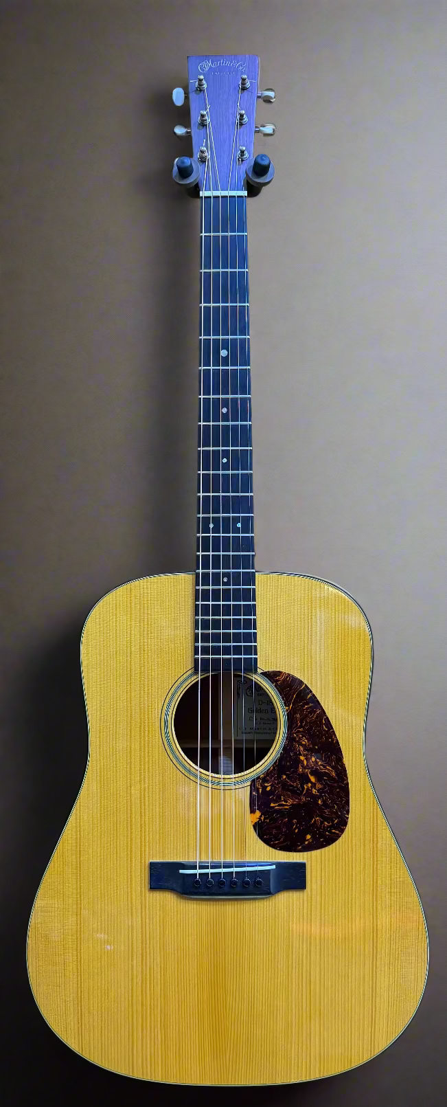 Acoustic guitar on a wooden surface