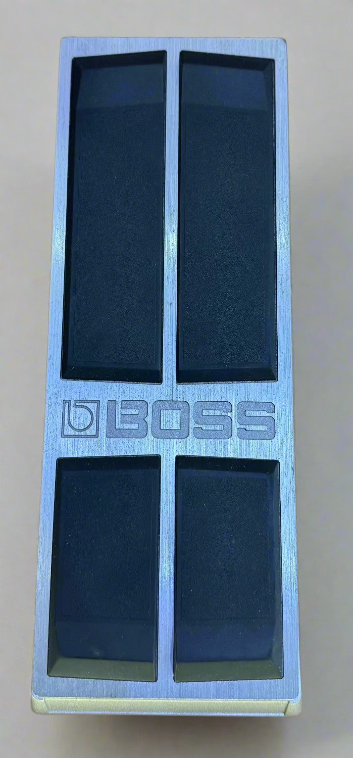 Boss guitar effects pedal on a wooden surface