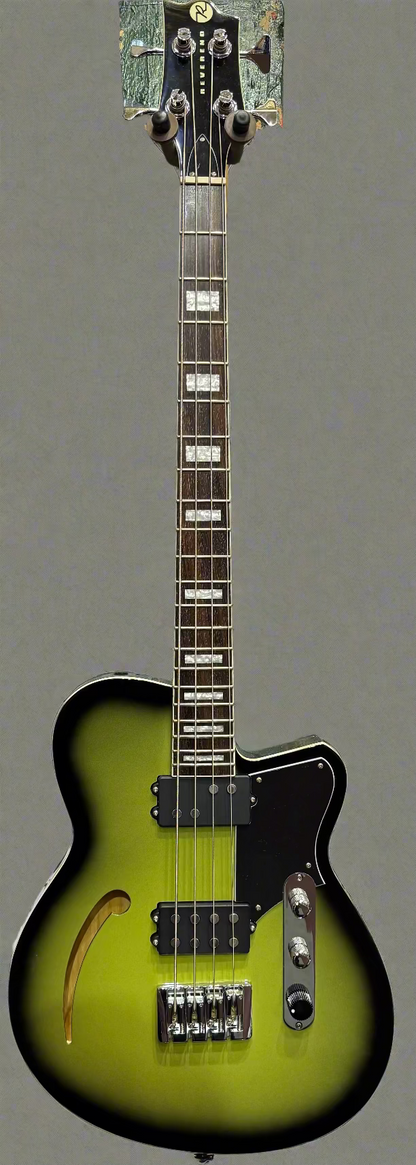 Green electric guitar with a red brick wall background