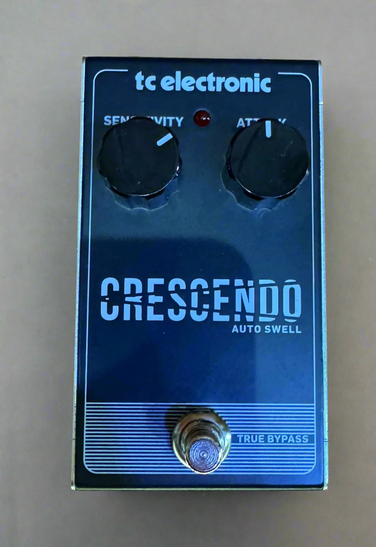 TC Electronic Crescendo Auto Swell guitar effects pedal on a wooden surface