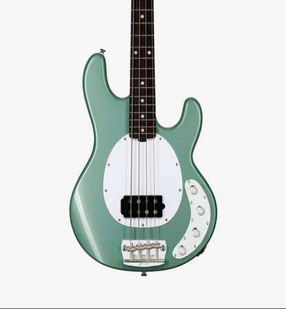 Green electric bass guitar on a white background