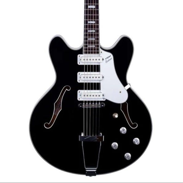 Black electric guitar on a white background